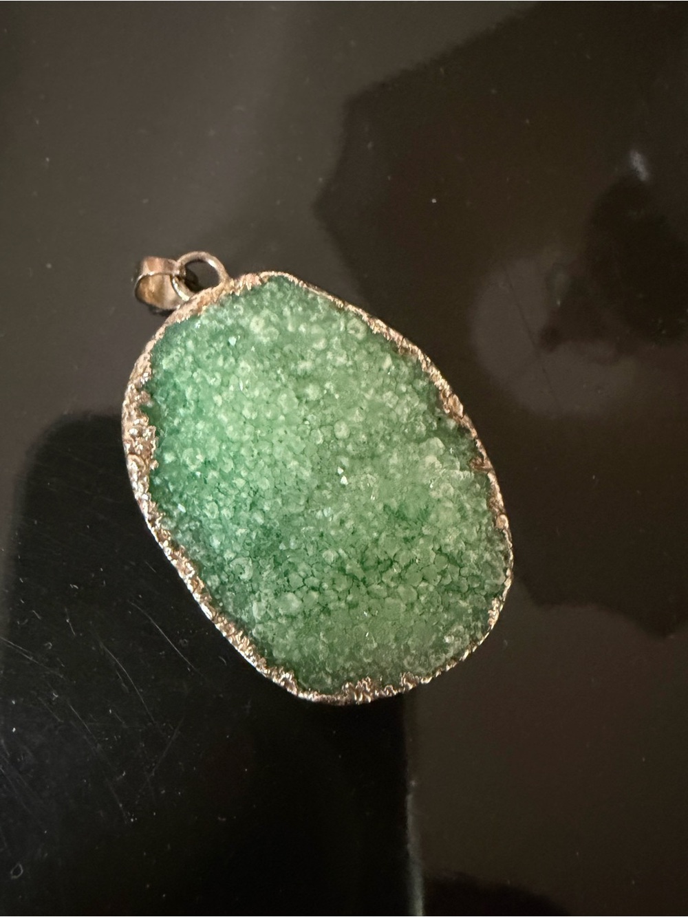 Green semi-precious stone pendant. Chain not included